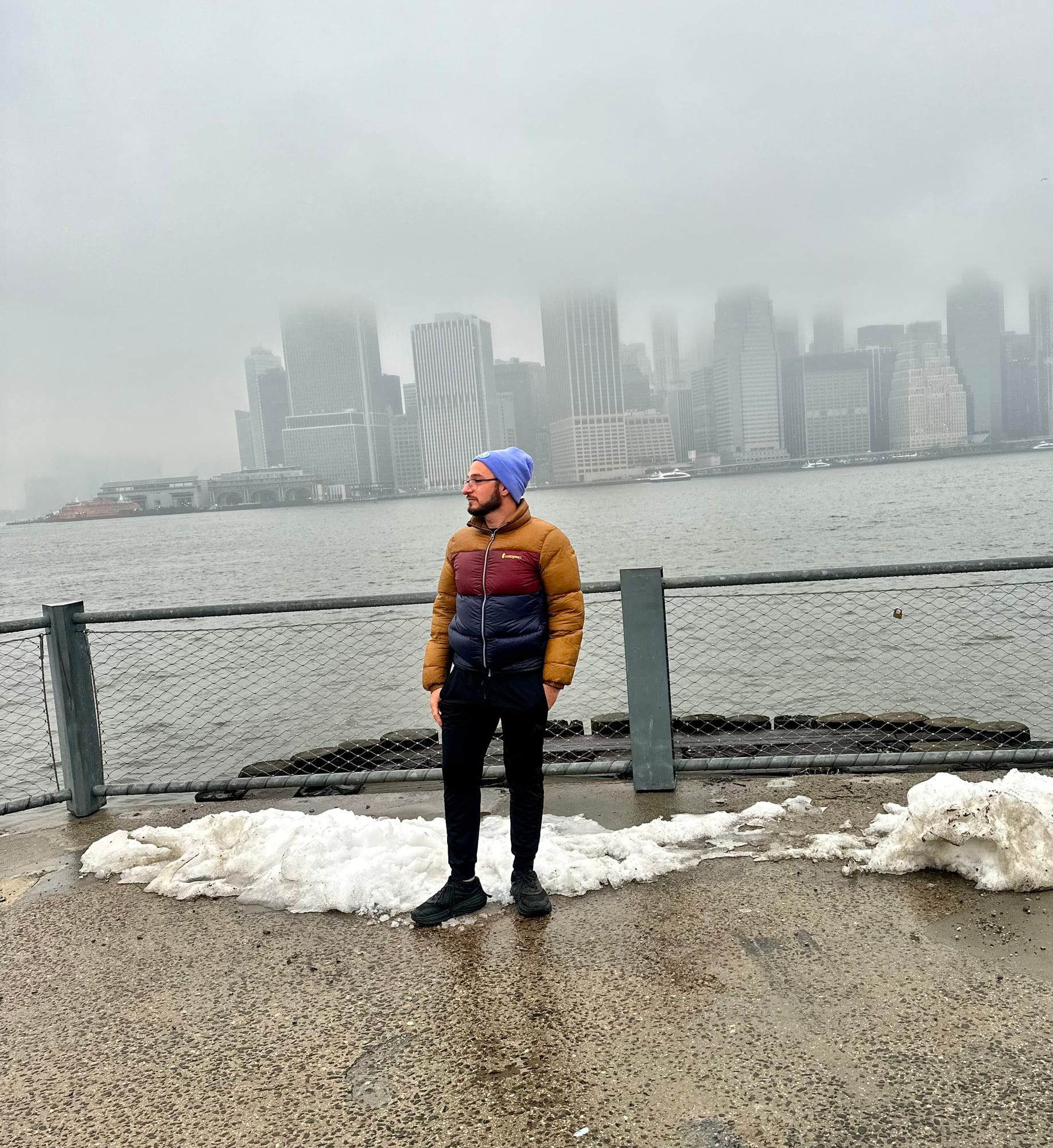 Shawn Levi, founder of Levi Tool & Co, standing at a waterfront with the NYC skyline